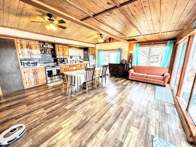 10921 N Pine Grove Ln, Bitely, MI 49309 - dining space featuring wood ceiling, a ceiling fan, and dark wood-style flooring