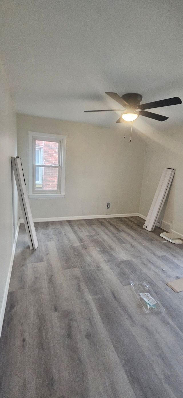 spare room featuring hardwood / wood-style floors and a textured ceiling