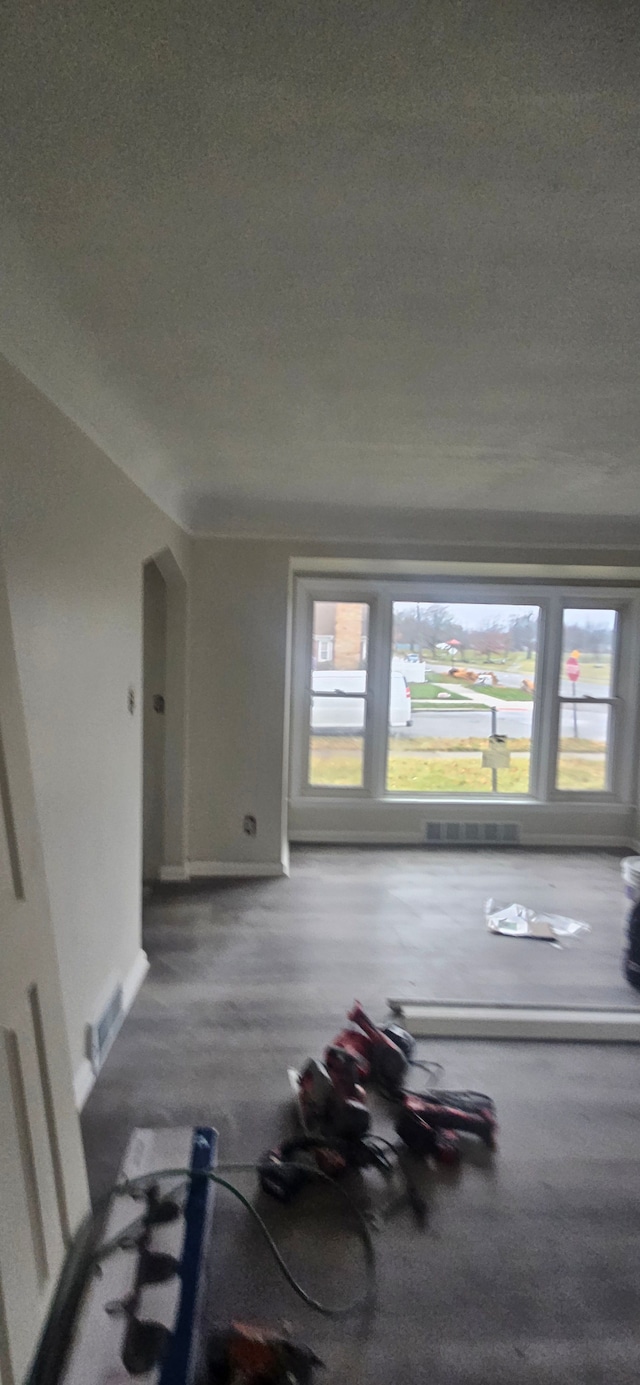 bonus room with a textured ceiling and a wealth of natural light