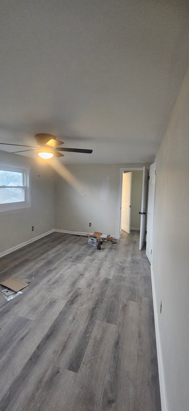 spare room featuring hardwood / wood-style floors and a textured ceiling