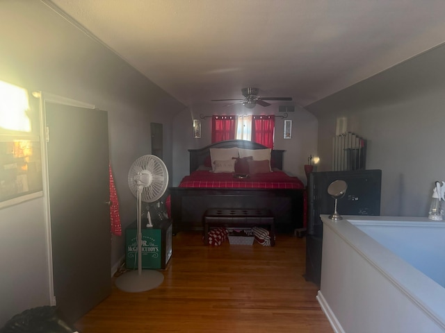 bedroom featuring hardwood / wood-style floors and ceiling fan