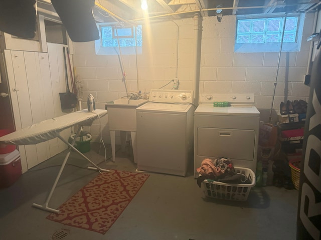 laundry room featuring washer and dryer and plenty of natural light