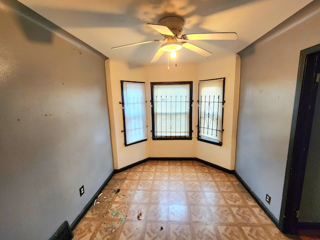 spare room featuring ceiling fan