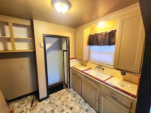 bathroom featuring vanity and backsplash