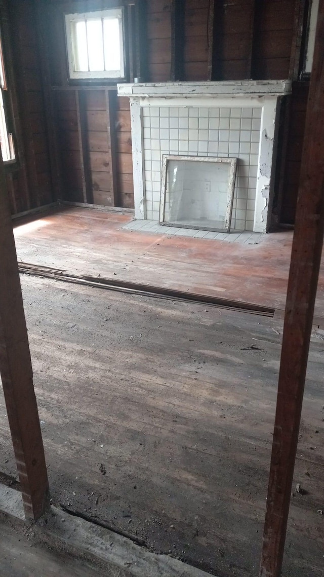 interior details featuring hardwood / wood-style floors and a fireplace