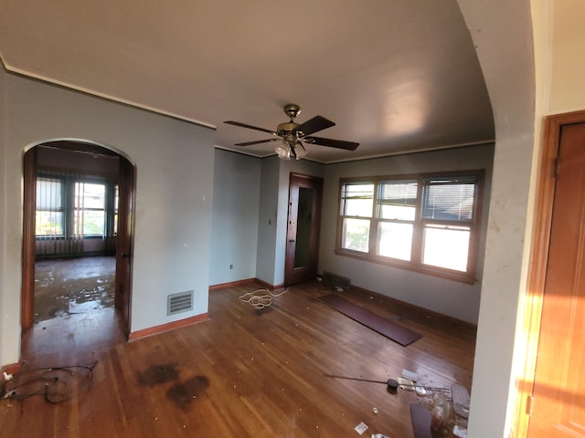 interior space with dark hardwood / wood-style flooring and ceiling fan