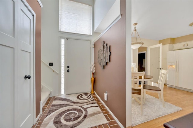 entryway with wood-type flooring