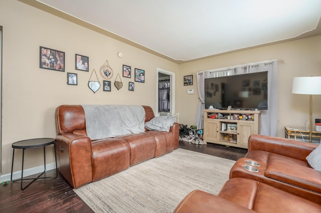 living room with dark hardwood / wood-style floors