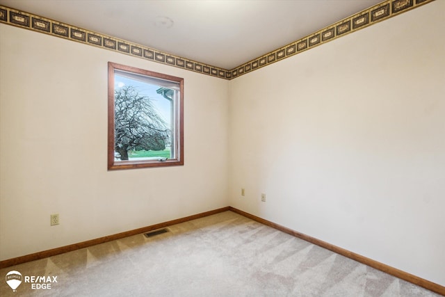 spare room featuring carpet floors