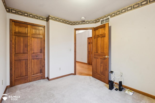 unfurnished bedroom featuring carpet flooring