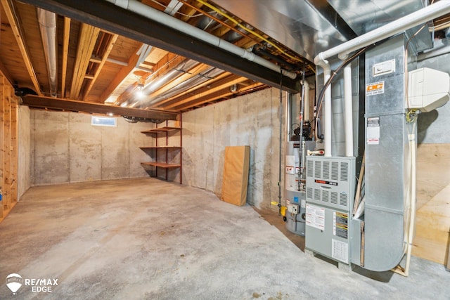 basement with gas water heater and heating unit