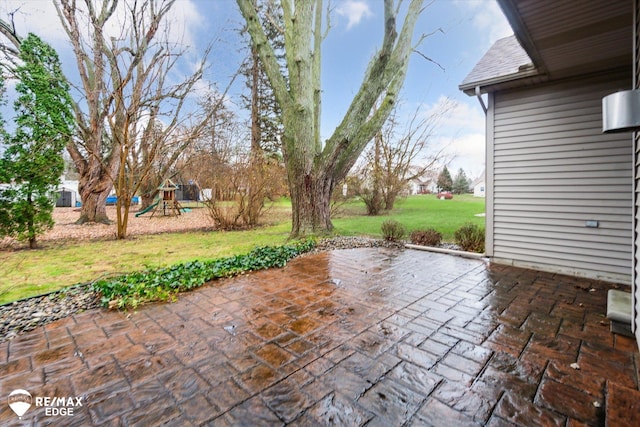 view of patio with a playground