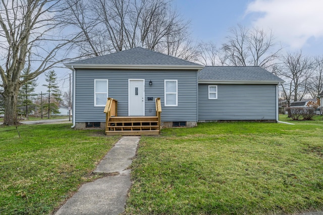 308 N Elm St, Three Oaks, MI 49128 - rear view of house featuring roof with shingles and a lawn
