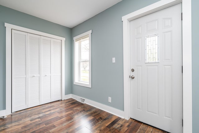 308 N Elm St, Three Oaks, MI 49128 - entryway featuring dark wood-type flooring and baseboards