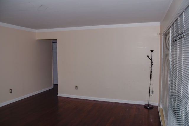 unfurnished room with dark wood-type flooring