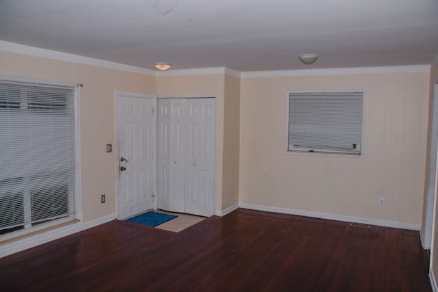 interior space with crown molding and hardwood / wood-style floors