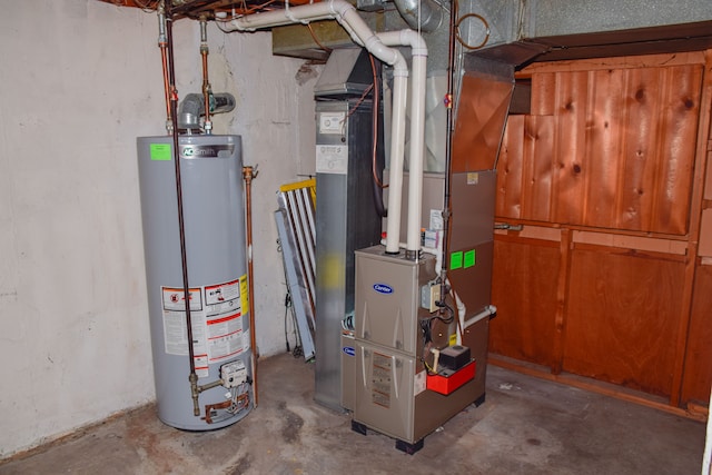 utility room featuring gas water heater