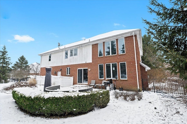 view of snow covered house