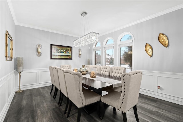 dining room with a notable chandelier, crown molding, and dark wood-type flooring