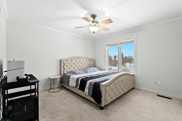 bedroom featuring ceiling fan, light colored carpet, and ornamental molding