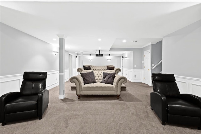 carpeted living room featuring ornamental molding