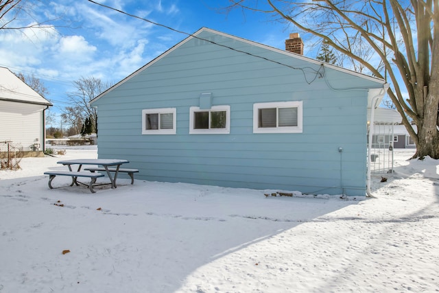 view of snow covered property