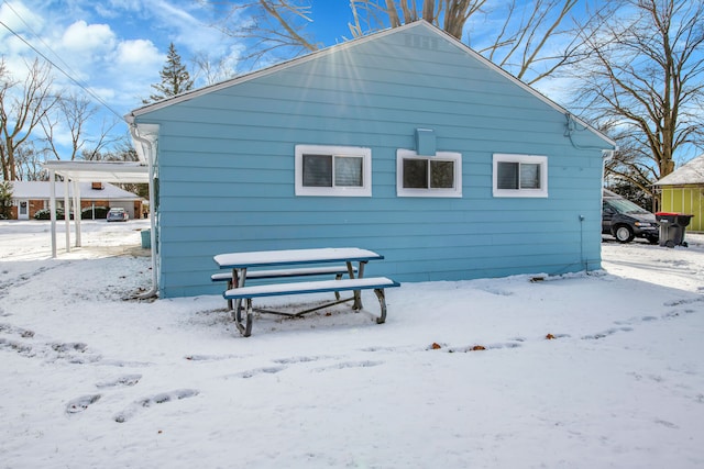 view of snow covered house