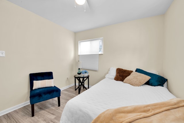 bedroom with ceiling fan and wood-type flooring