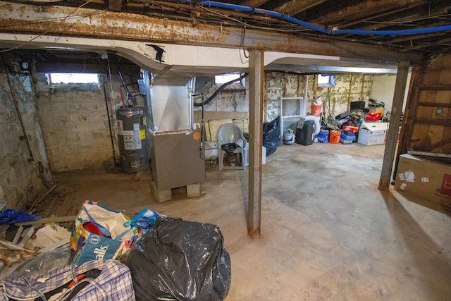 basement with gas water heater and heating unit