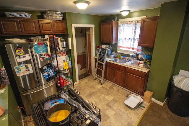 kitchen featuring sink and stainless steel refrigerator