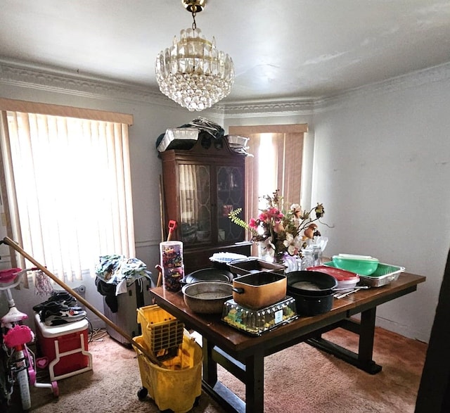 carpeted dining space featuring crown molding and a chandelier