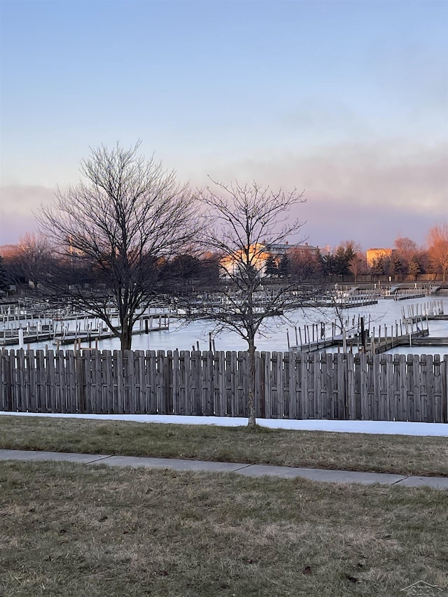 yard at dusk with a water view