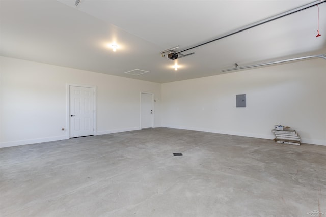 garage featuring a garage door opener and electric panel