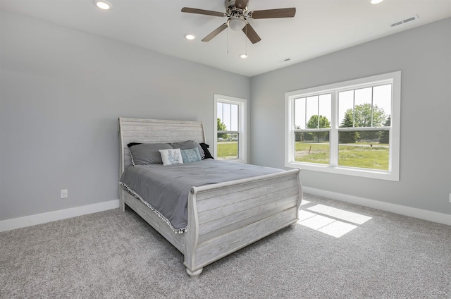 carpeted bedroom with ceiling fan