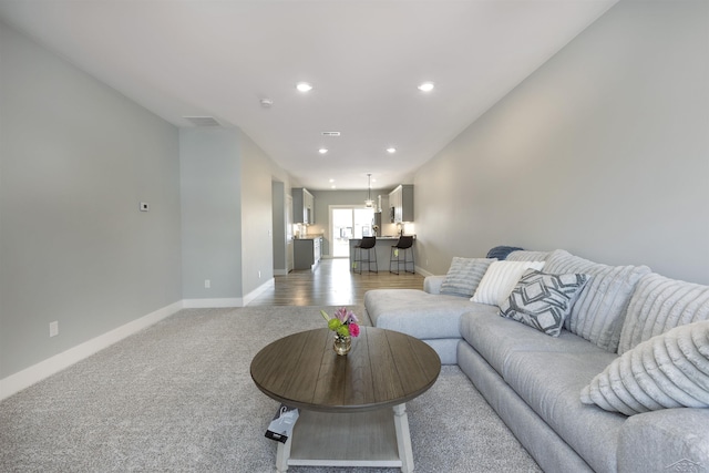 living room with light colored carpet