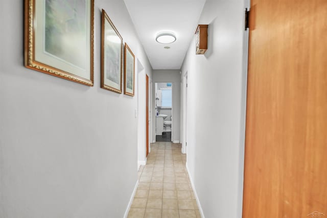 hallway with light tile patterned floors