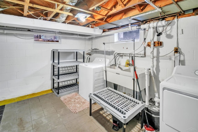 laundry area featuring sink and independent washer and dryer