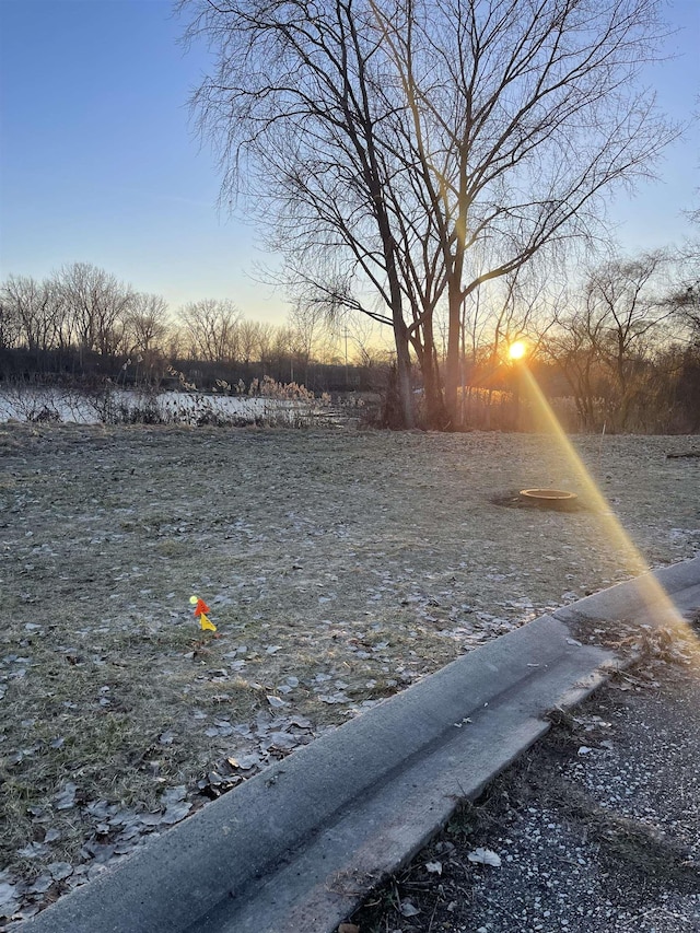 view of yard at dusk