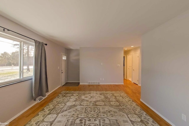 unfurnished room featuring light wood-type flooring