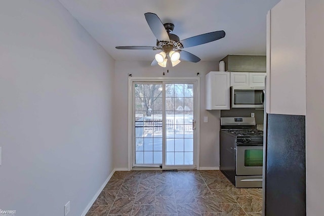 kitchen with white cabinets, ceiling fan, and appliances with stainless steel finishes