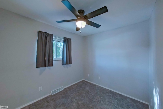 carpeted empty room featuring ceiling fan