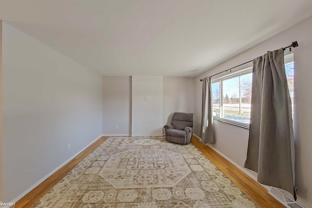 living area with hardwood / wood-style floors