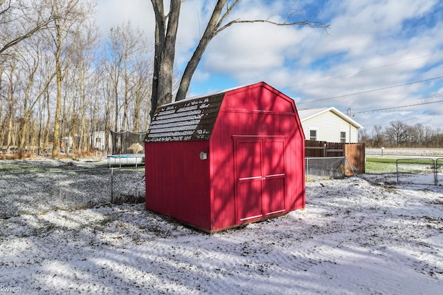 snow covered structure featuring a trampoline