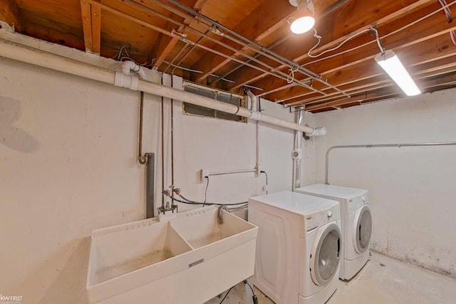 laundry area featuring separate washer and dryer and sink