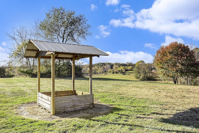 surrounding community featuring a gazebo and a lawn