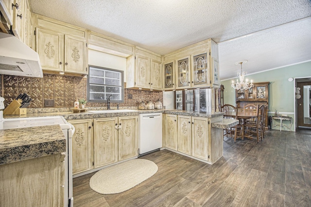 kitchen featuring stove, white dishwasher, sink, range hood, and kitchen peninsula