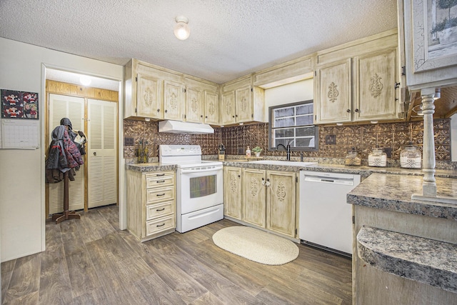 kitchen with backsplash, dark hardwood / wood-style flooring, a textured ceiling, white appliances, and sink