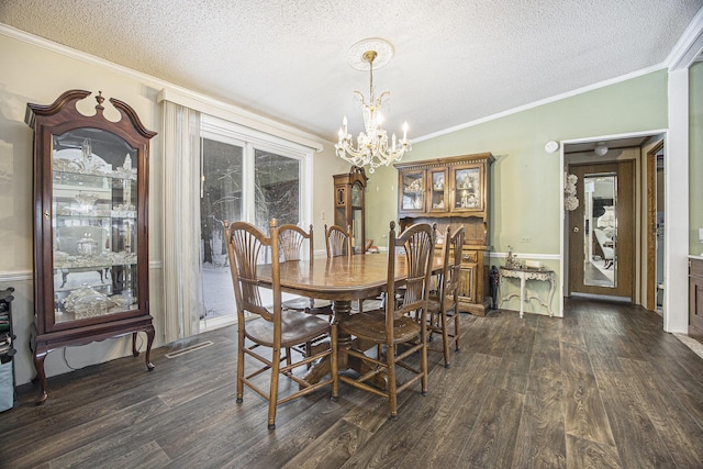 dining space with an inviting chandelier, dark hardwood / wood-style flooring, crown molding, a textured ceiling, and vaulted ceiling