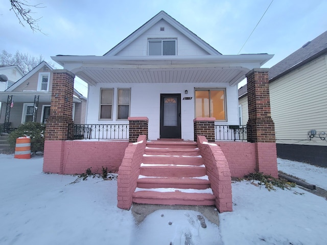 bungalow-style house featuring covered porch