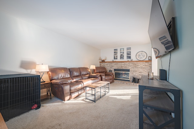 carpeted living room with a brick fireplace